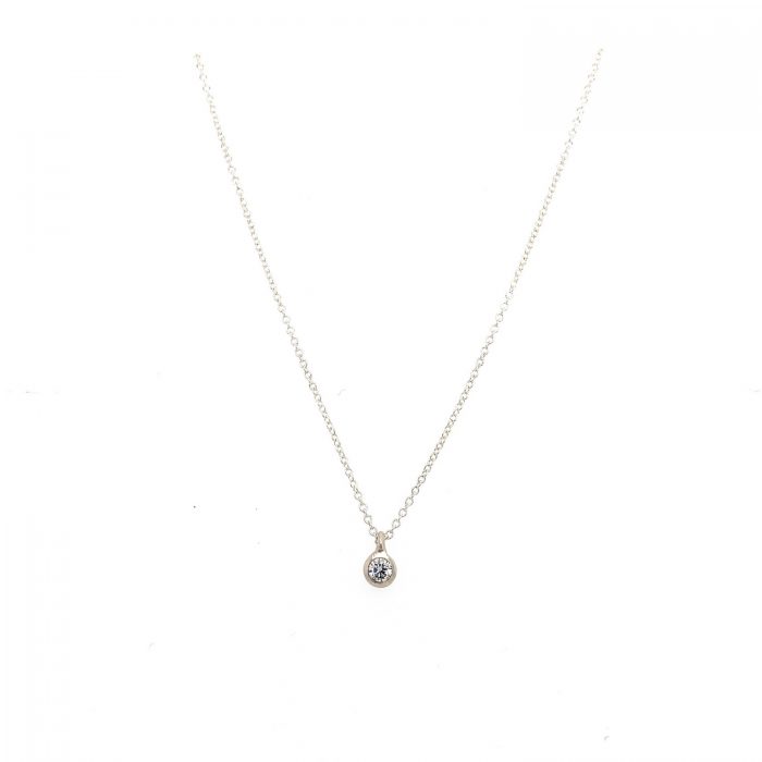 Just a Diamond Necklace with a 12 point diamond set in a matte finishe bezel.